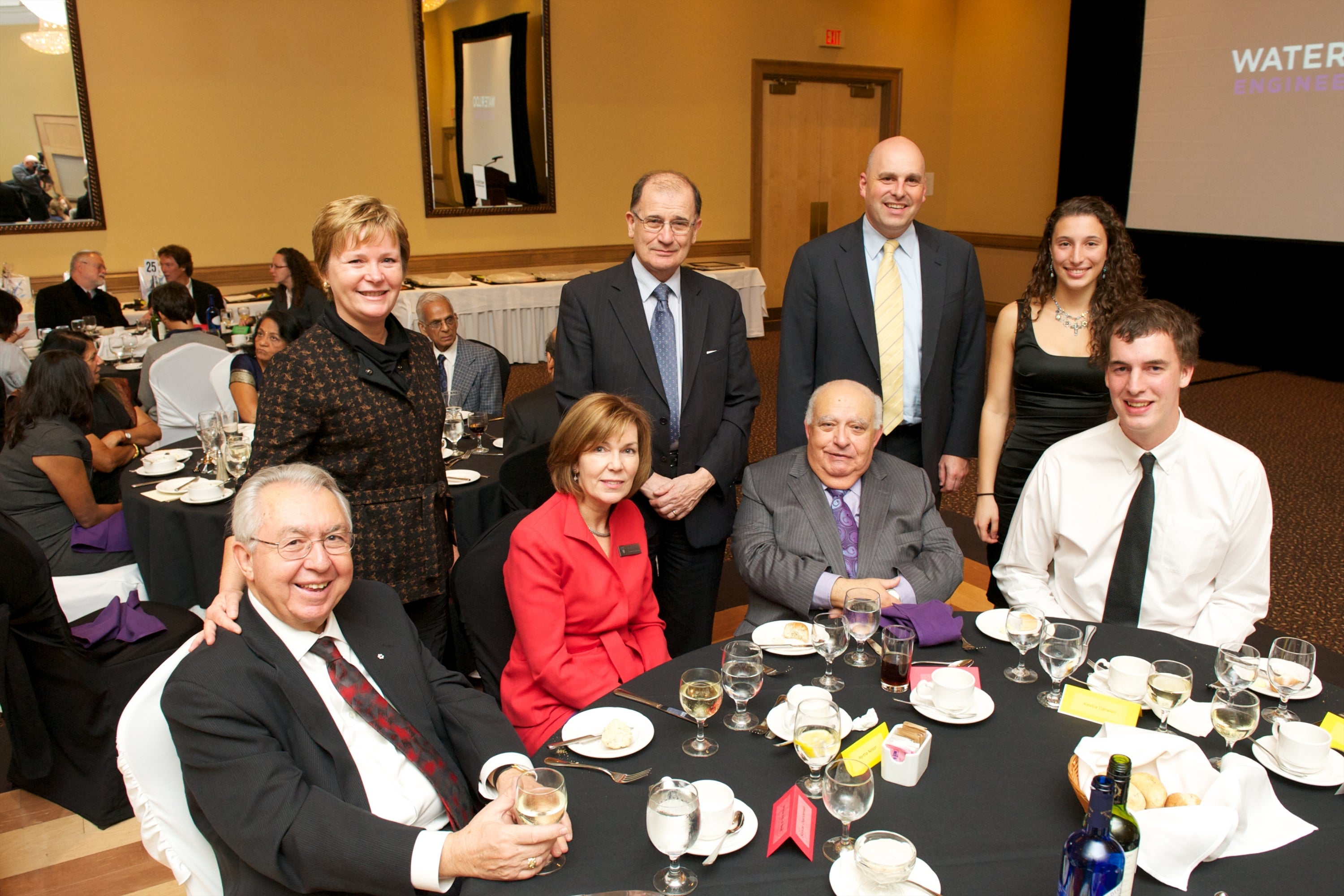 Attendees gather around Dean of Engineering, Adel Sedra.