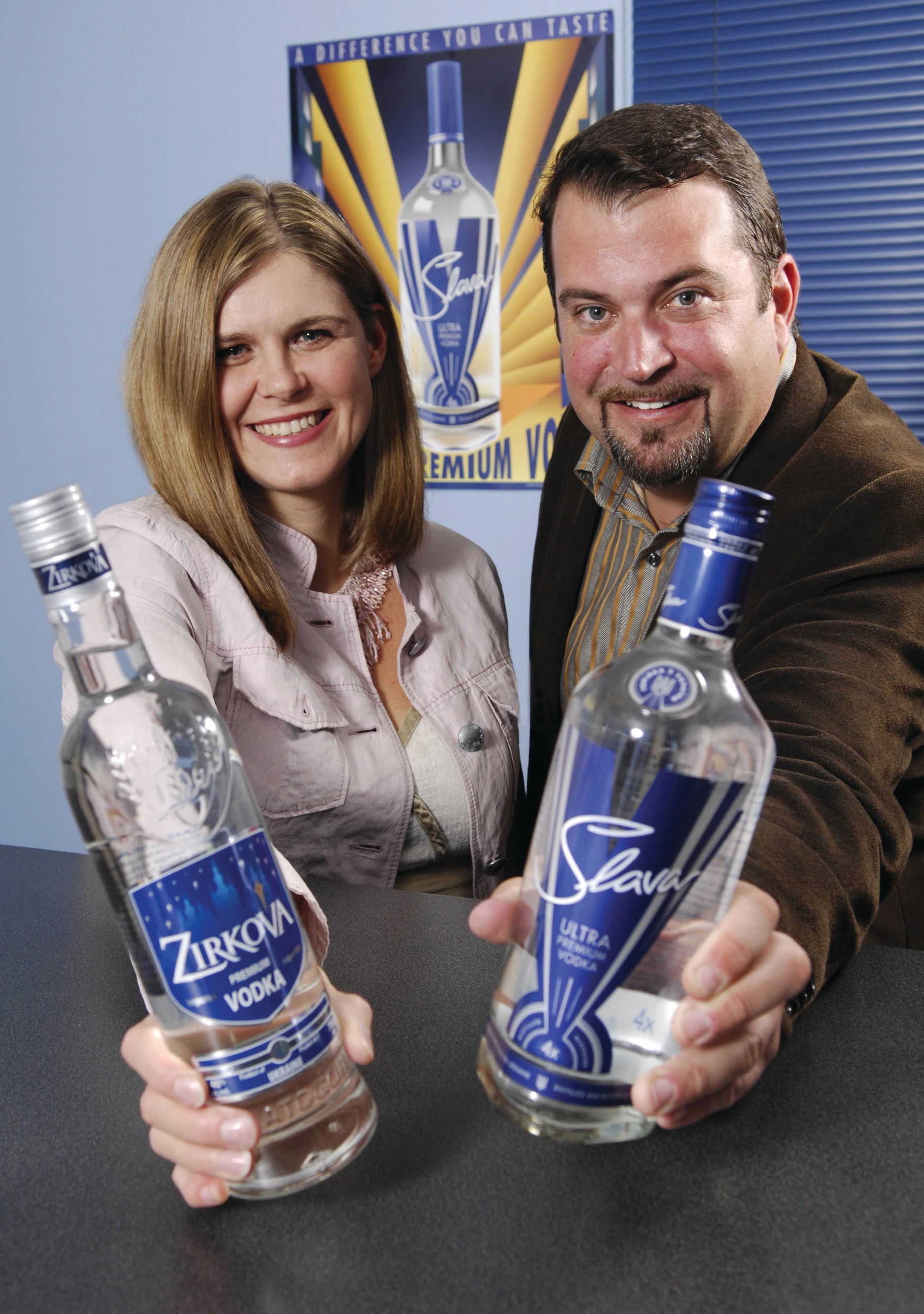 Katherine Koszarny Vellinga (BASc '92) and John Vellinga (BASc '91) with their two vodka brands: Zirkova and Slava