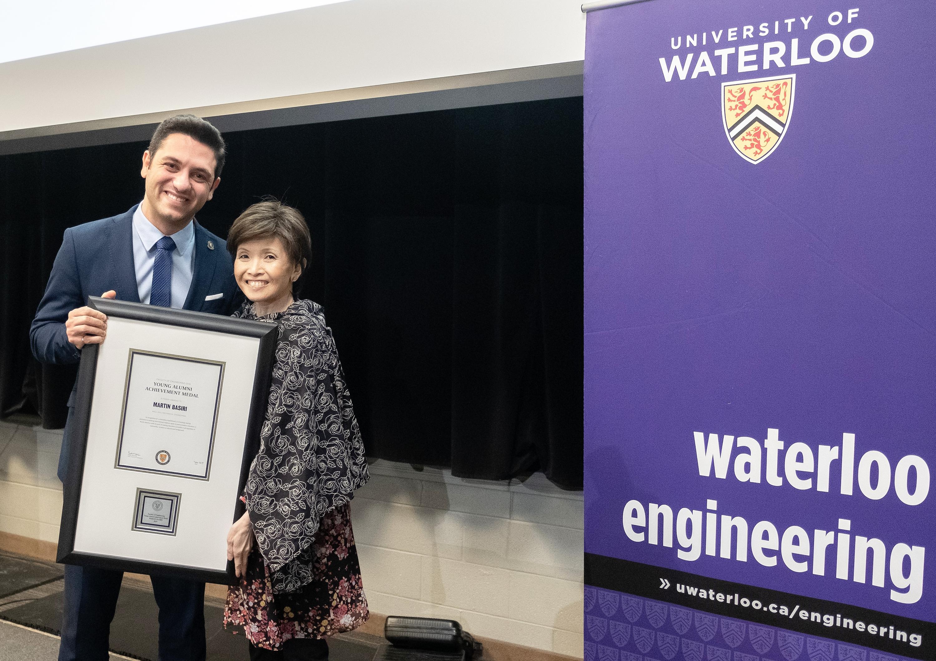 Martin Basiri, left, poses with his award with Dean Pearl Sullivan.