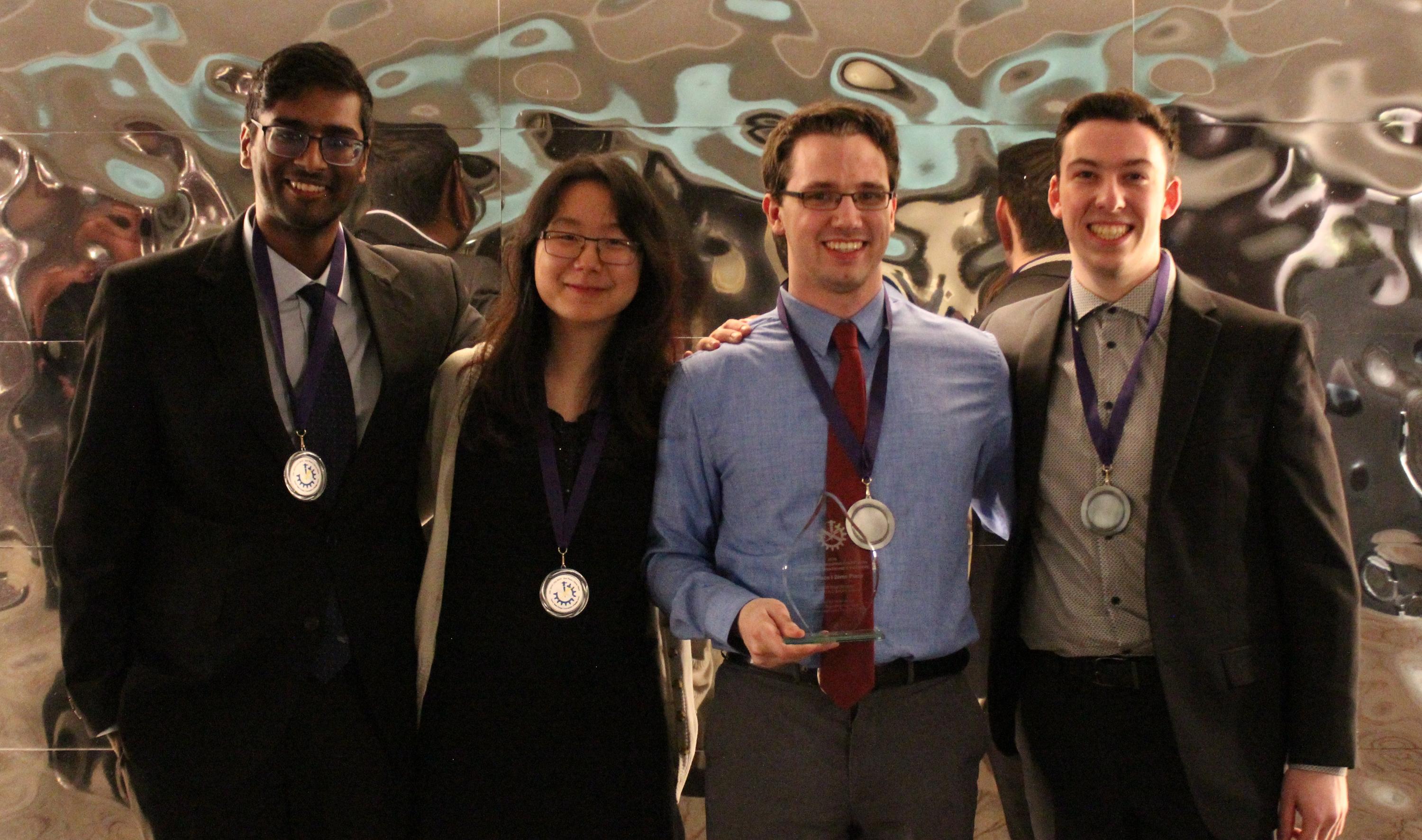 Waterloo Engineering teammates (left to right) Yuvin Weerasinghe, Jia Xin (Maggie) Han, Patrick Groh and Kripstopher Griffin pose with their prizes at the recent Canadian Engineering Competition.