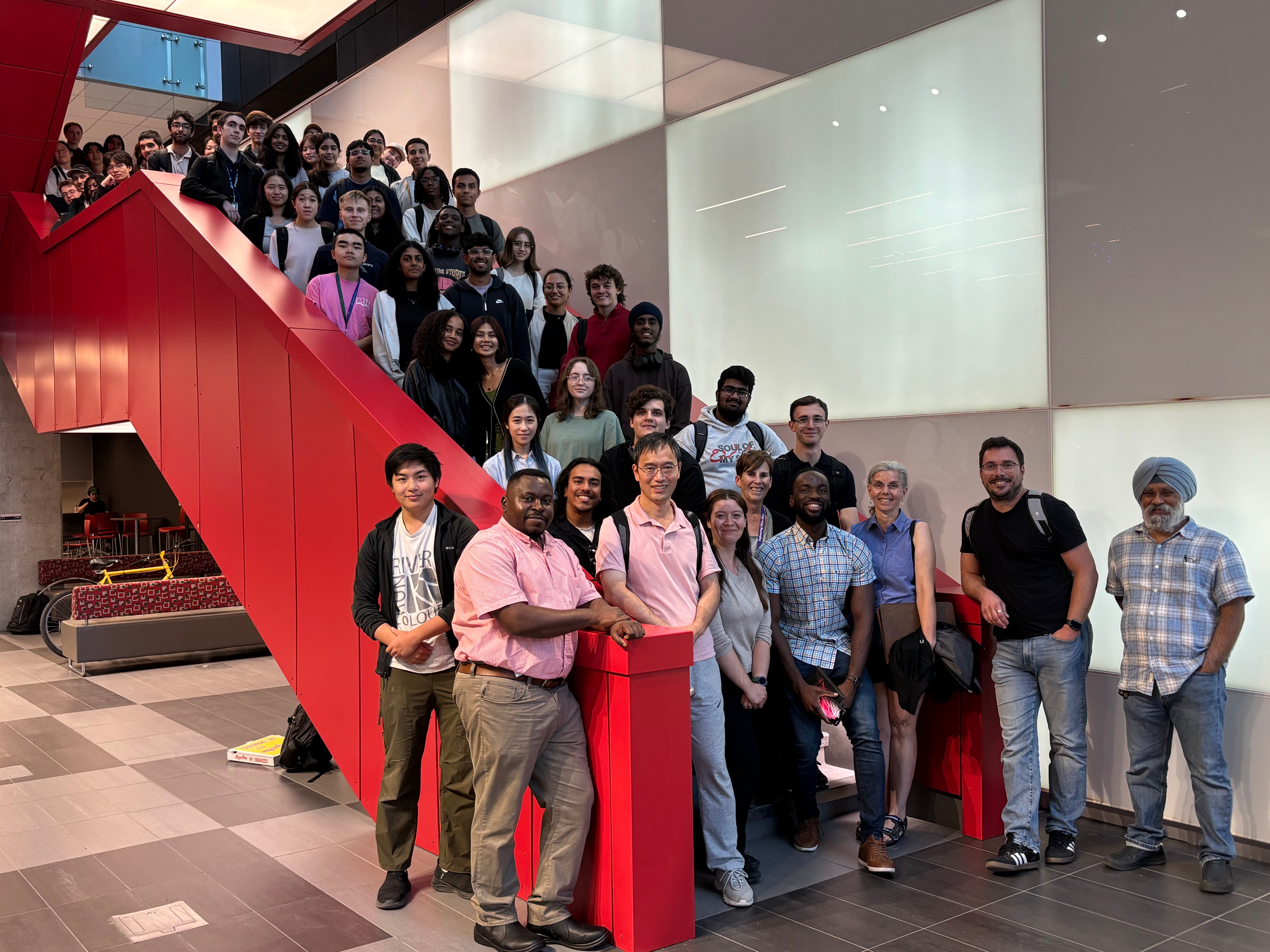 People on red stairs