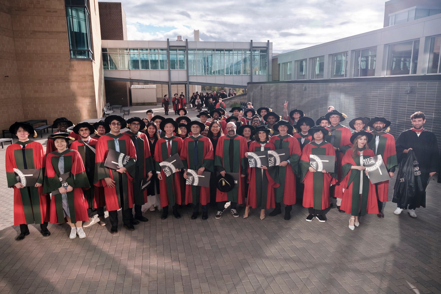A large group shot of graduates outside