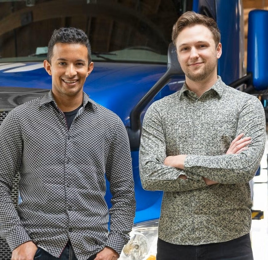 Alex and Brandon standing side by side