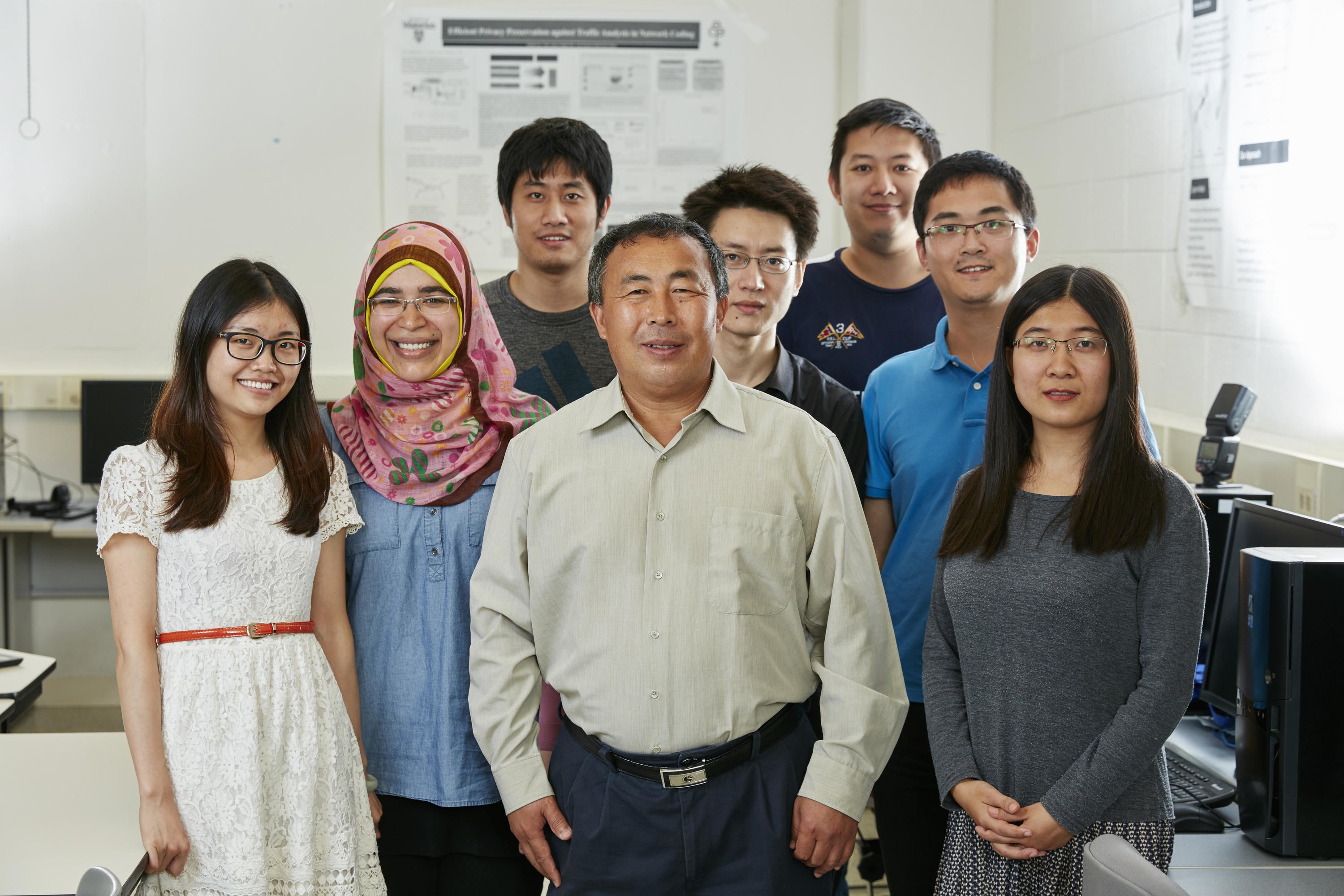 Sherman Shen, electrical and computer engineering professor, and students