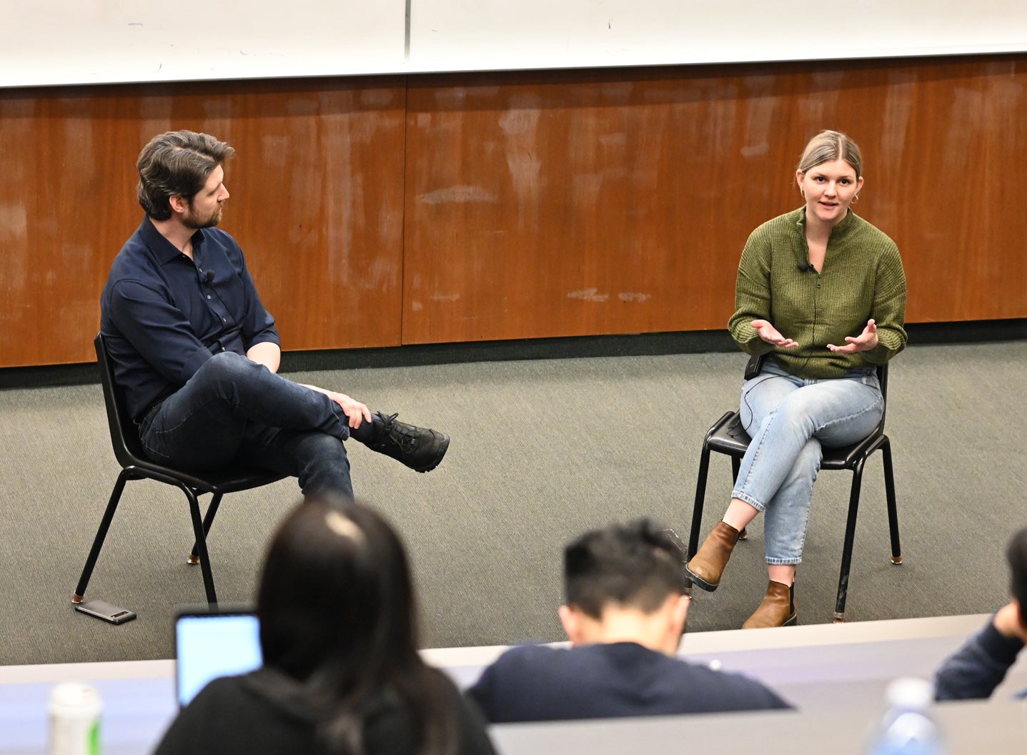 Eric Blondeel of Velocity and Kayli Dale co-founder of Friendlier sitting at front of classroom in conversation.