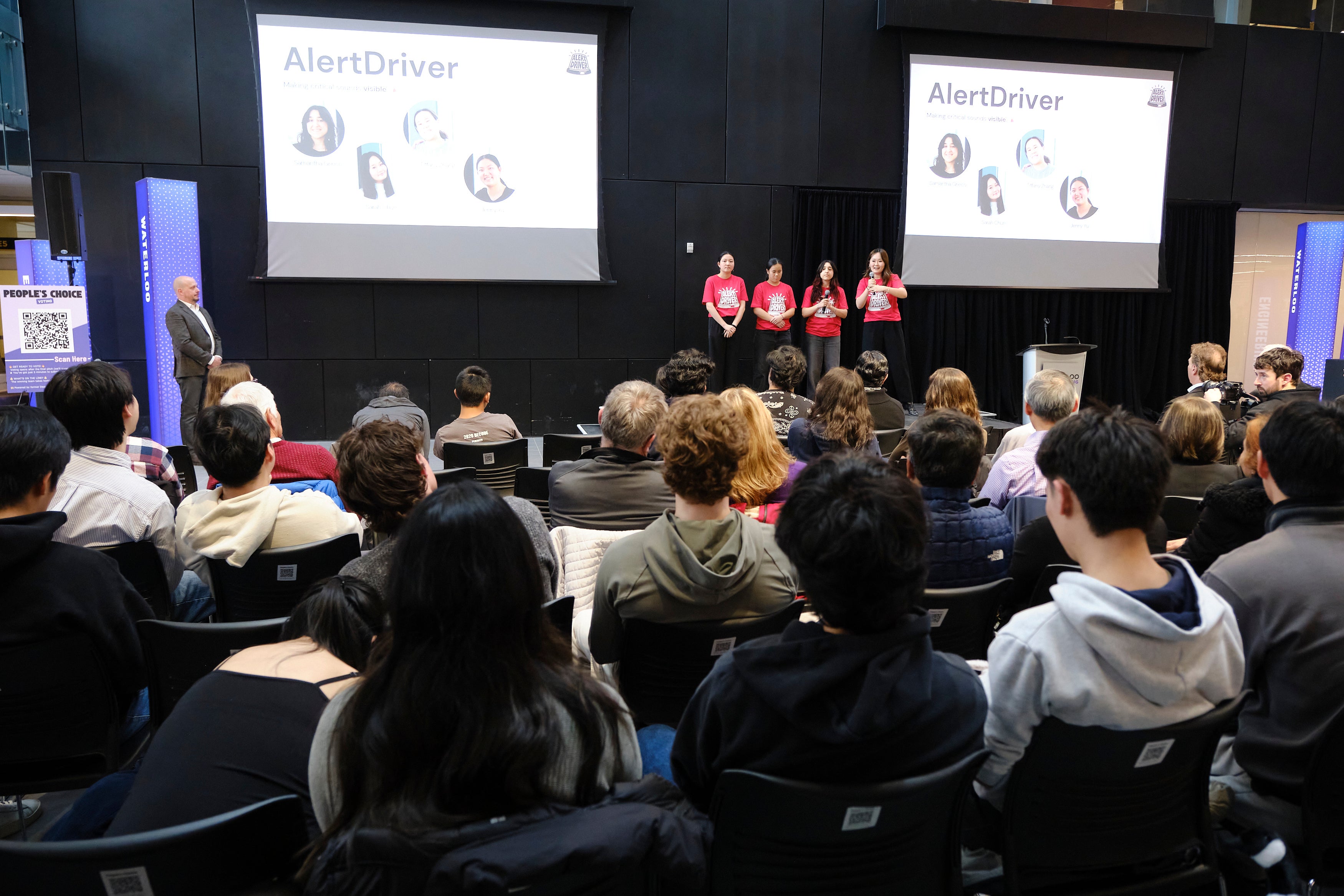 Group of students presenting in a pitch competition