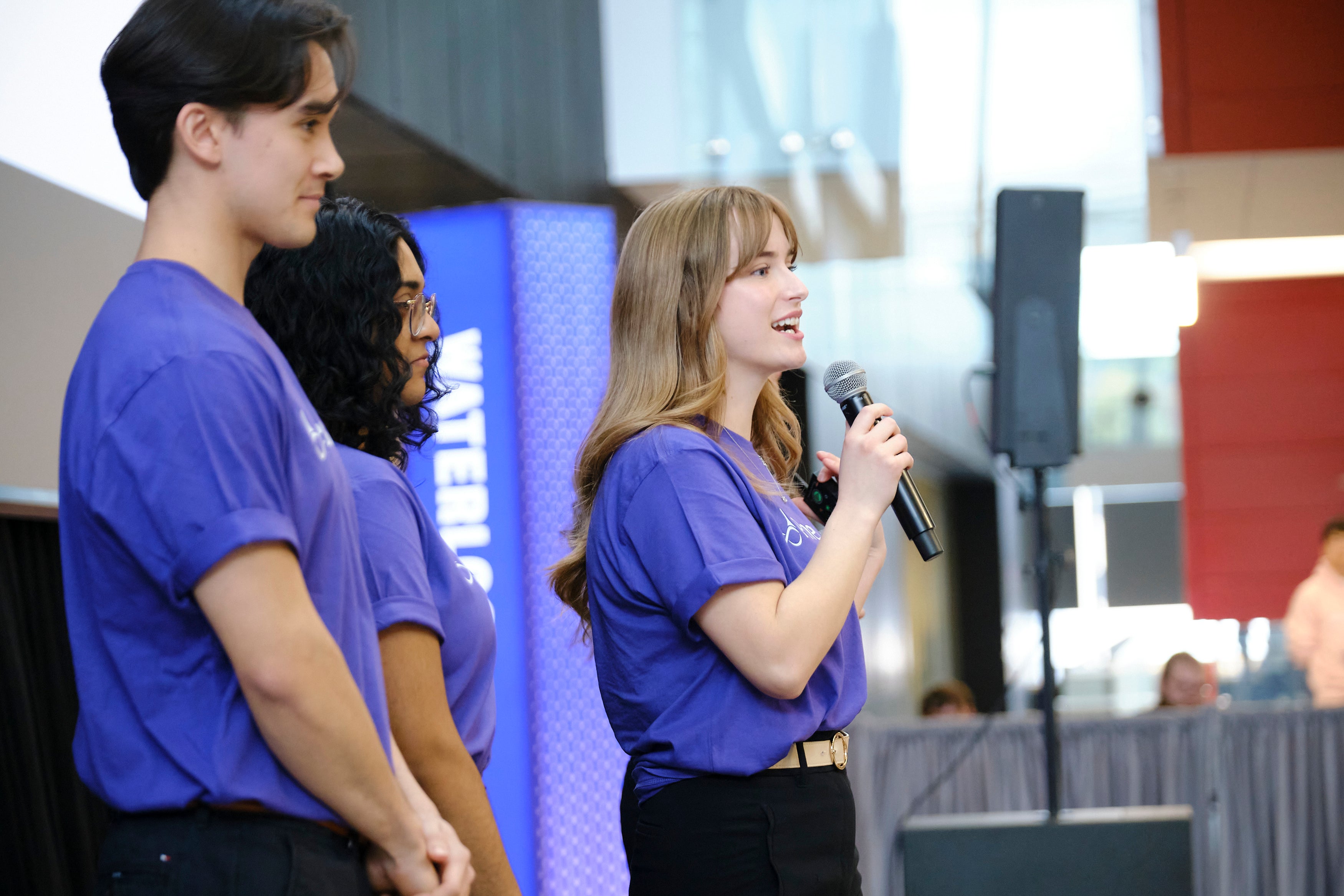 Student talking into microphone