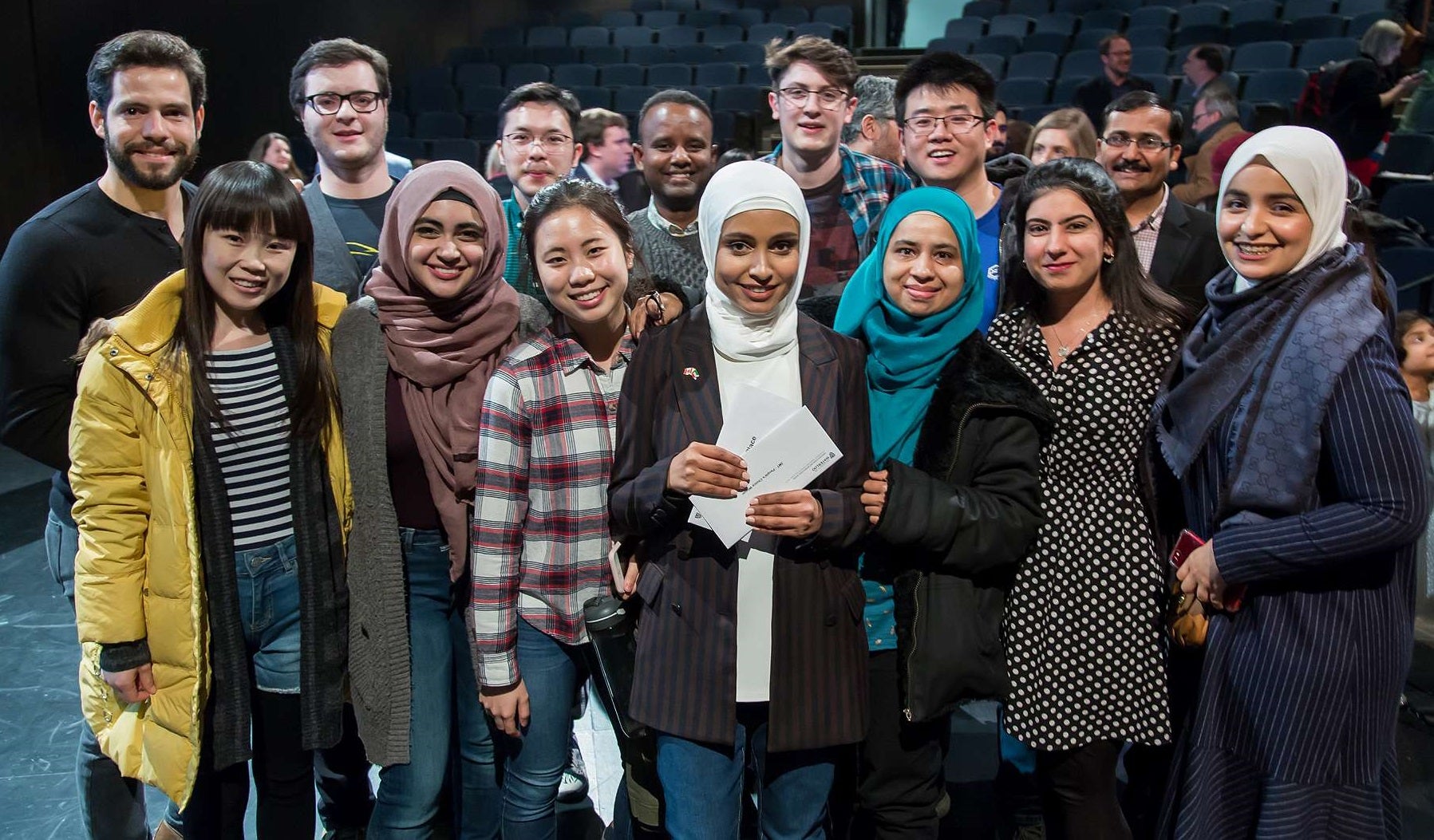 Haya Almutairi poses with supports after winning the 3MT finals at the University of Waterloo.