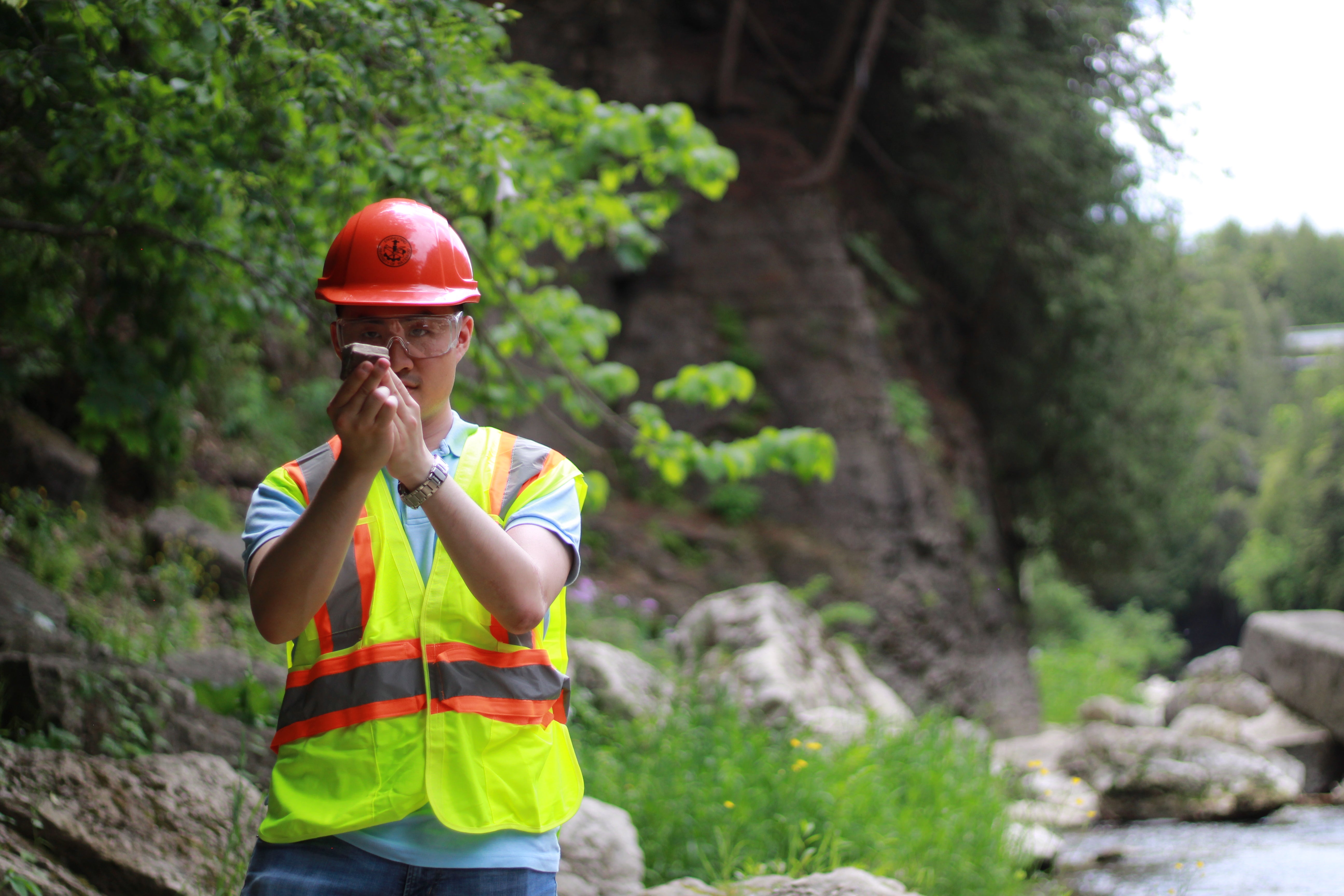 Student analyzing rock