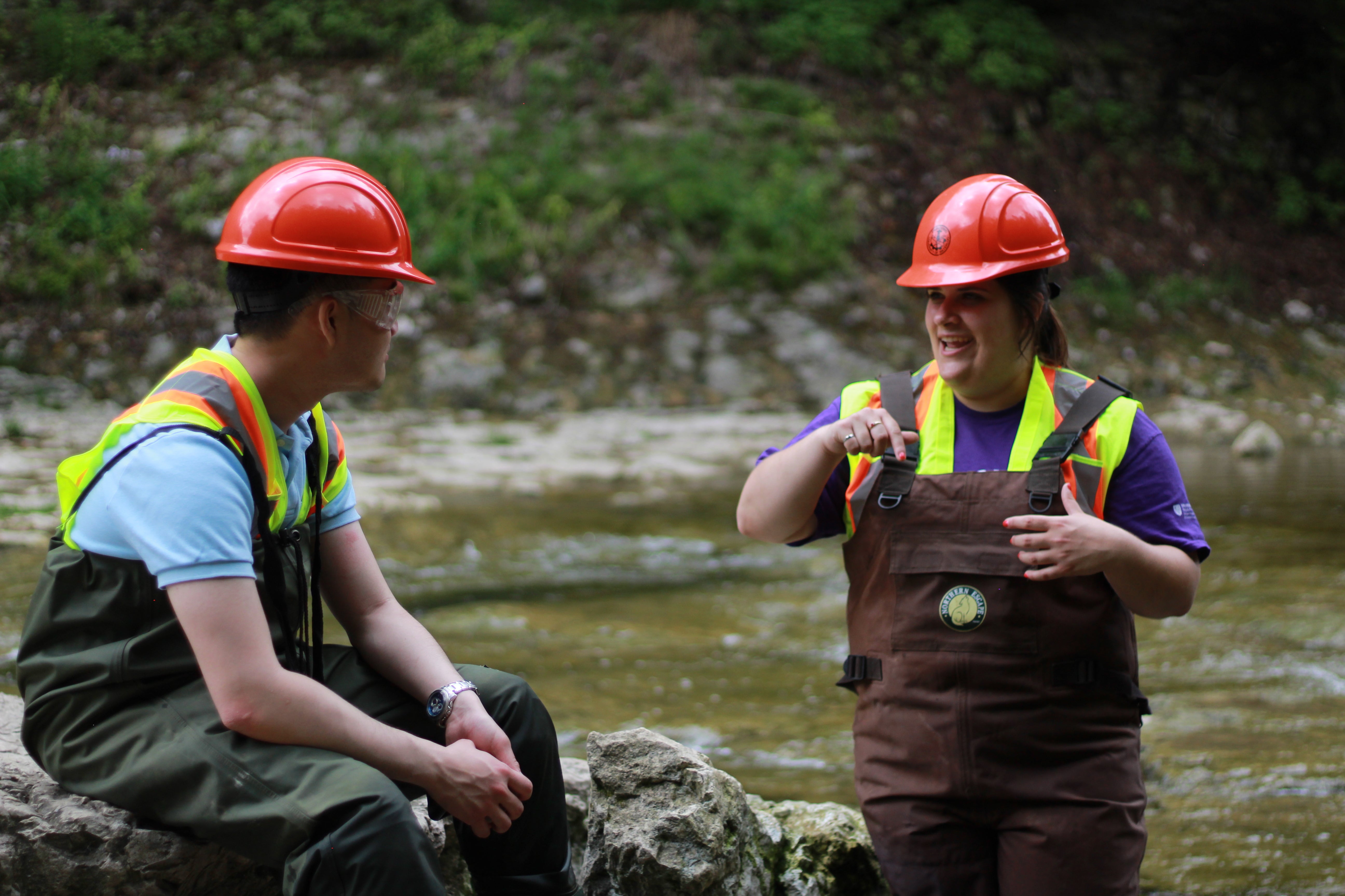 Students talking in river