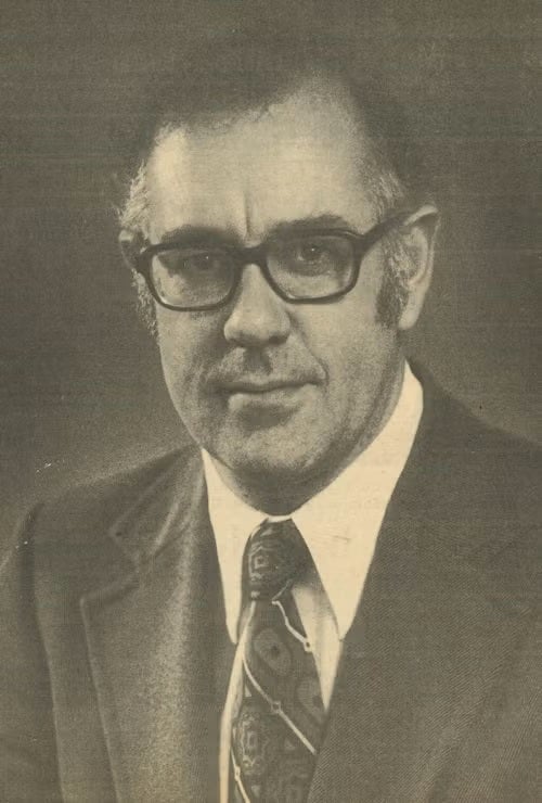 A man looks at the camera.