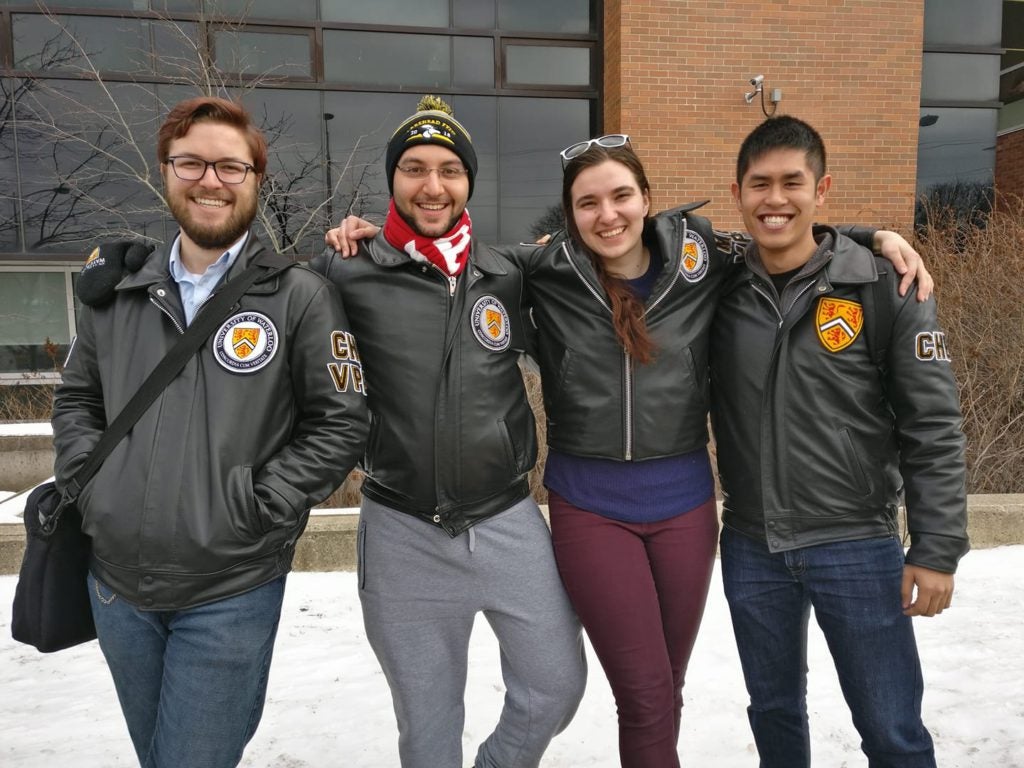 four engineers in their leather jackets