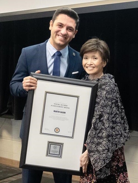 Martin Basiri, left, poses with Pearl Sullivan, the former dean of Waterloo Engineering, during a 2019 awards dinner.