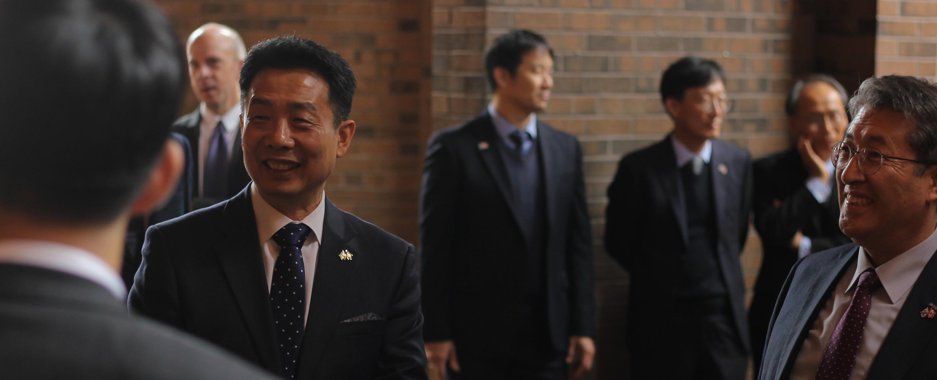 HJ Kwon, a professor at Waterloo Engineering, socializes with dignitaries at a signing ceremony for the start of a research collaboration with South Korea.