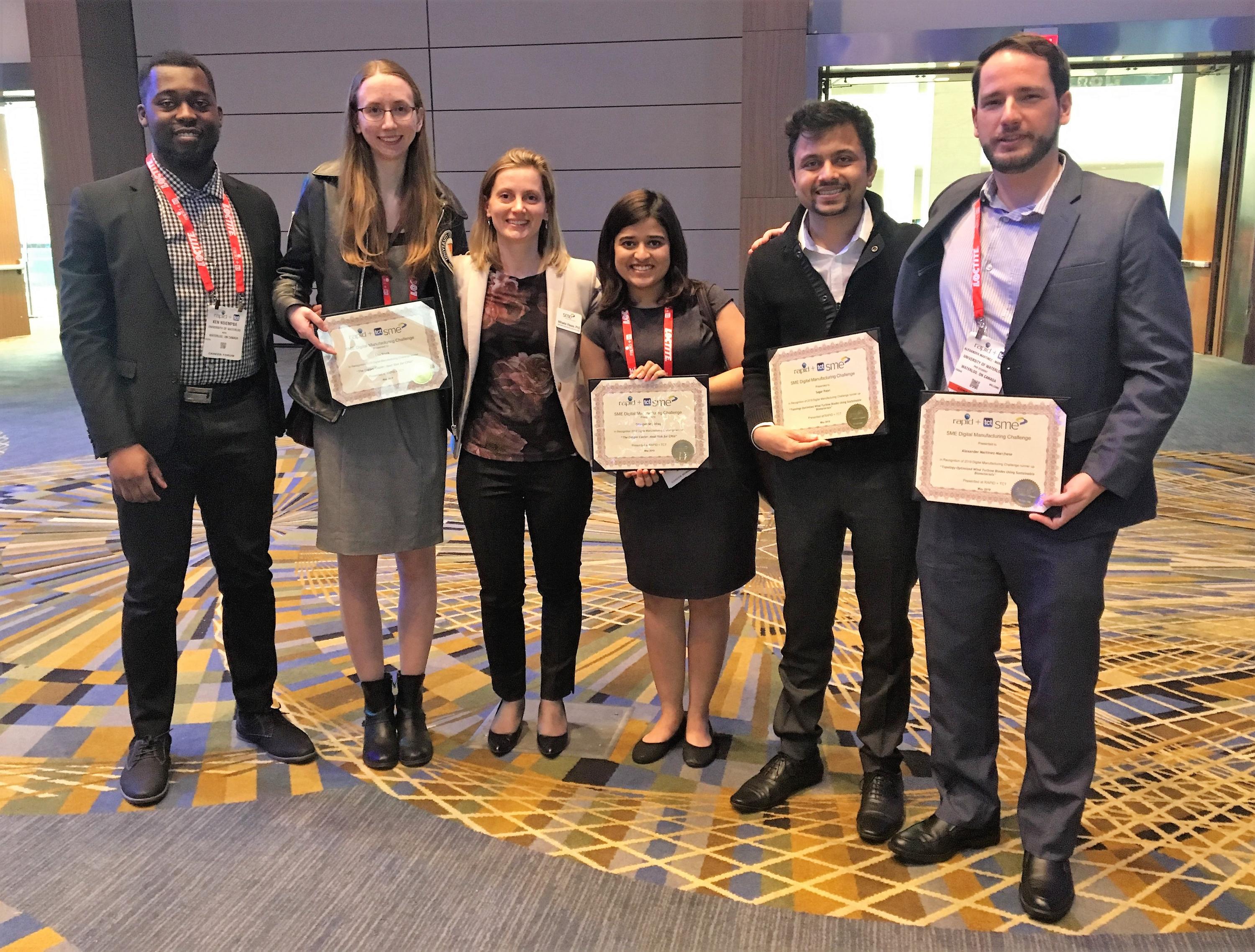 Graduate students (left to right) Ken Nsiempba, Lisa Brock, Gitanjali Shanbhag, Sagar Patel and Alex Martinez pose at the recent awards event with Mihaela Vlasea (third from left), a professor and associate research director at the MSAM Lab.