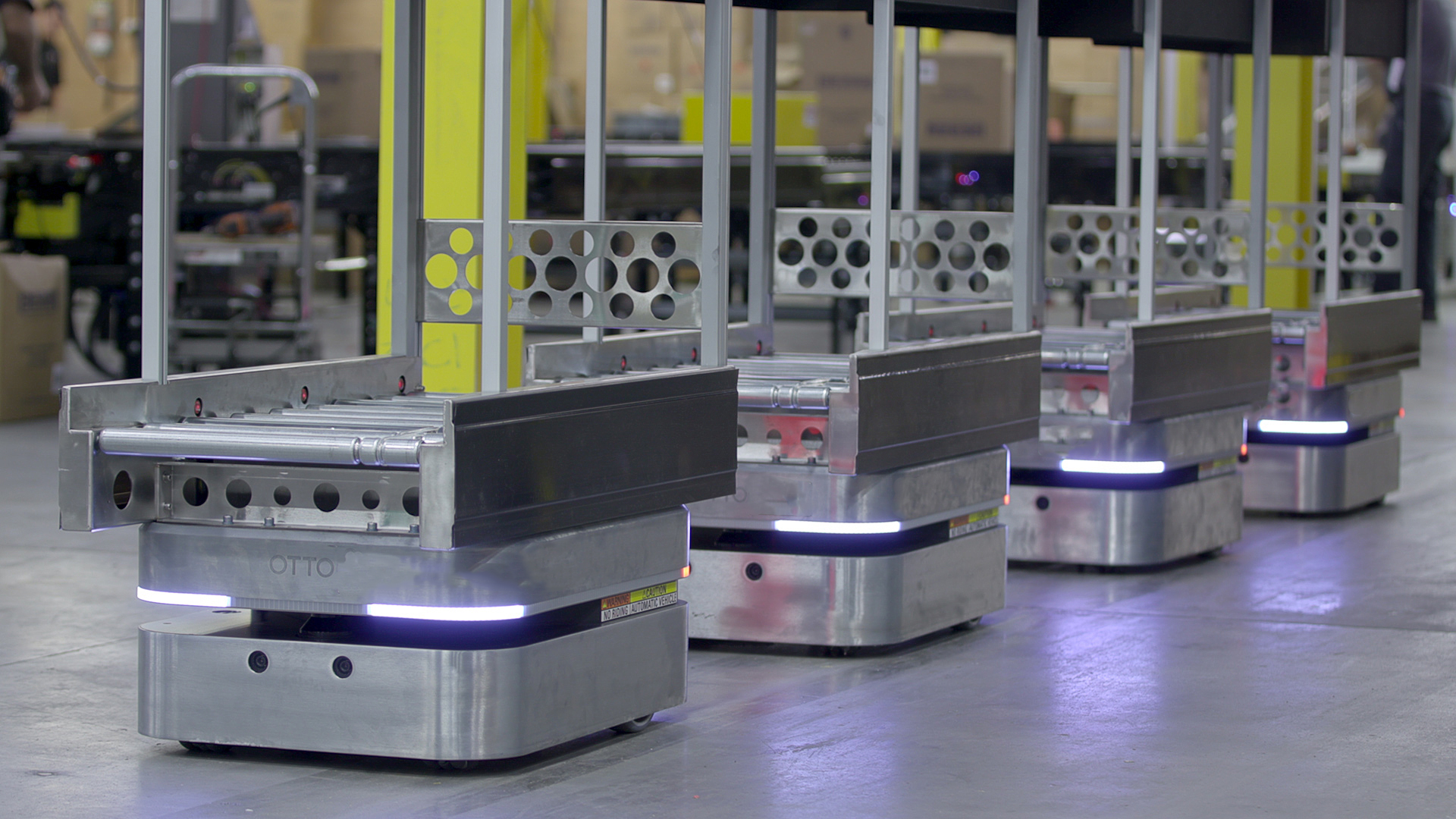 A fleet of Otto robots in a warehouse.