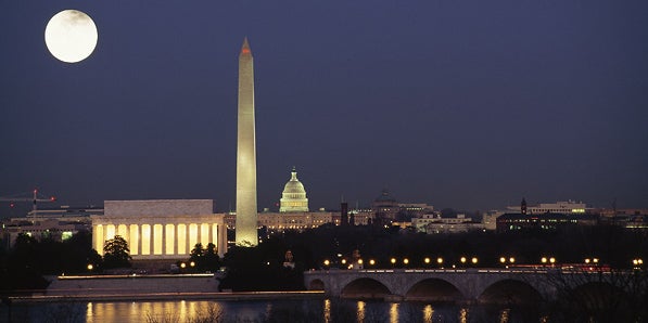 Washington D.C. skyline at night with full moon