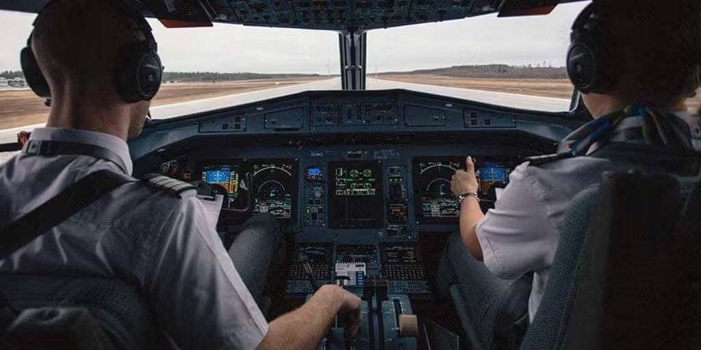 Two pilots in a plane cockpit taking off in a plane
