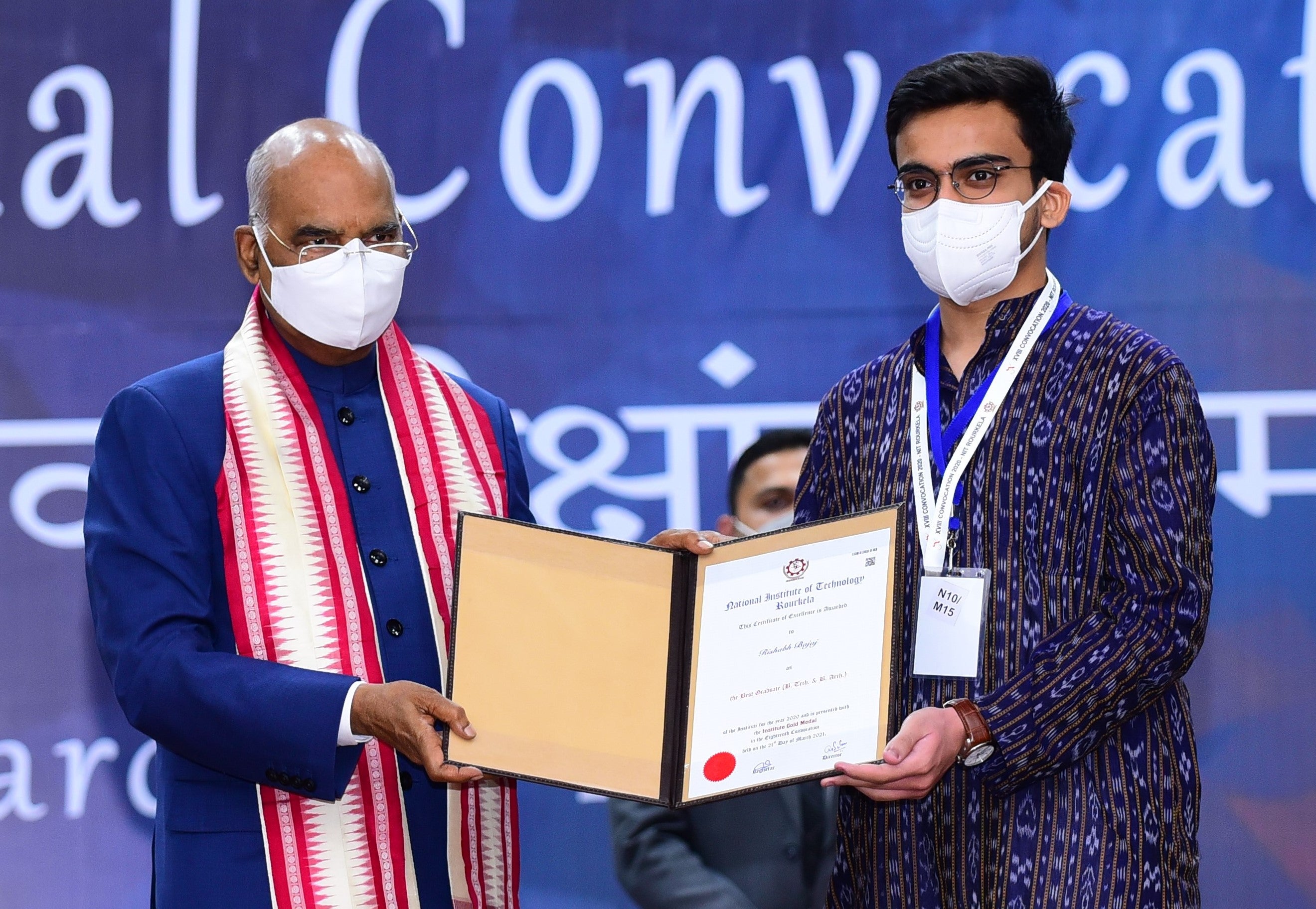 Waterloo Engineering doctoral student Rishabh Bajij (right) receives his award as top undergraduate student at NIT Rourkela from Ram Nath Kovind, the president of India.