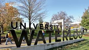 University of Waterloo sign with students walking by