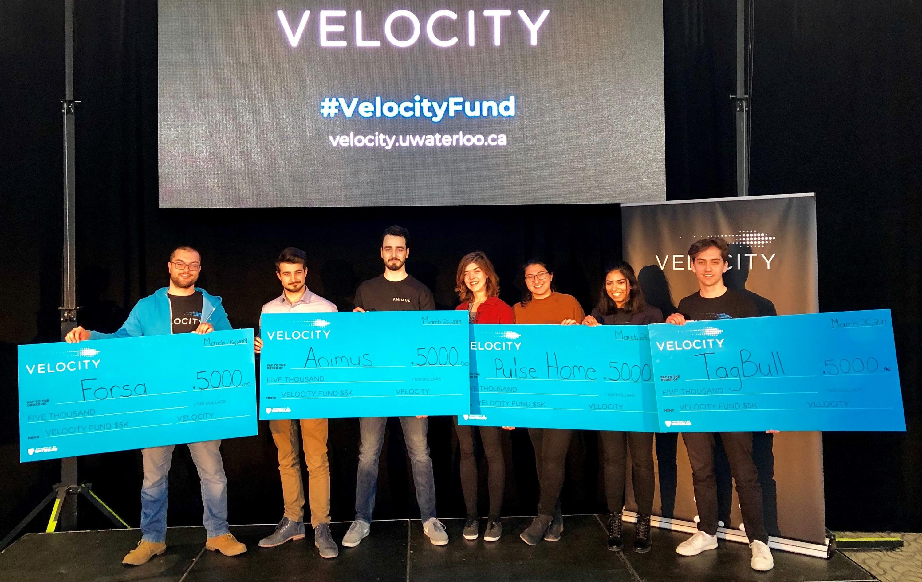 Winners of the $5K Velocity Fund Finals pitche event pose with their ceremonial cheques.