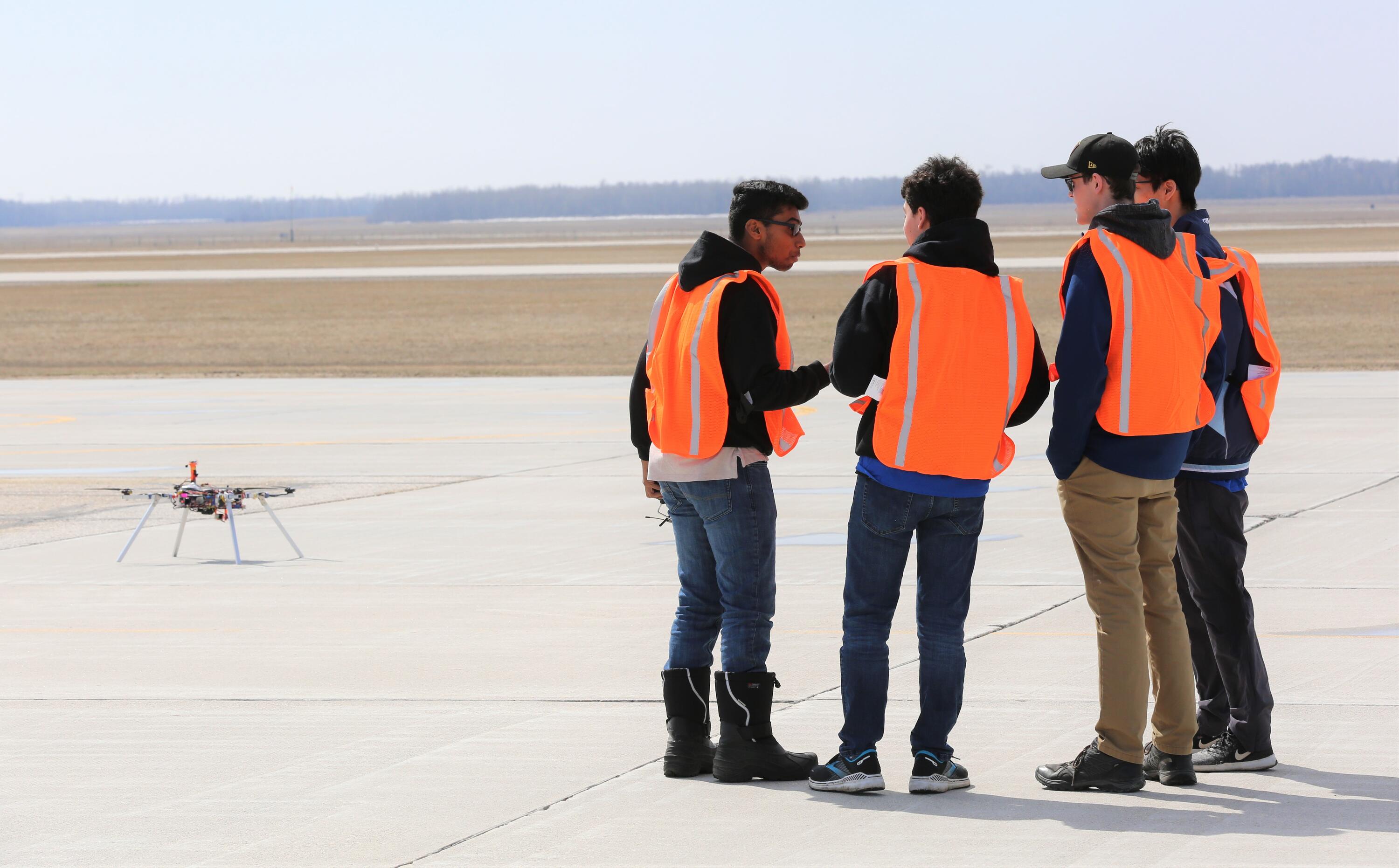 Members of student team WARG confer during a recent contest in Manitoba.