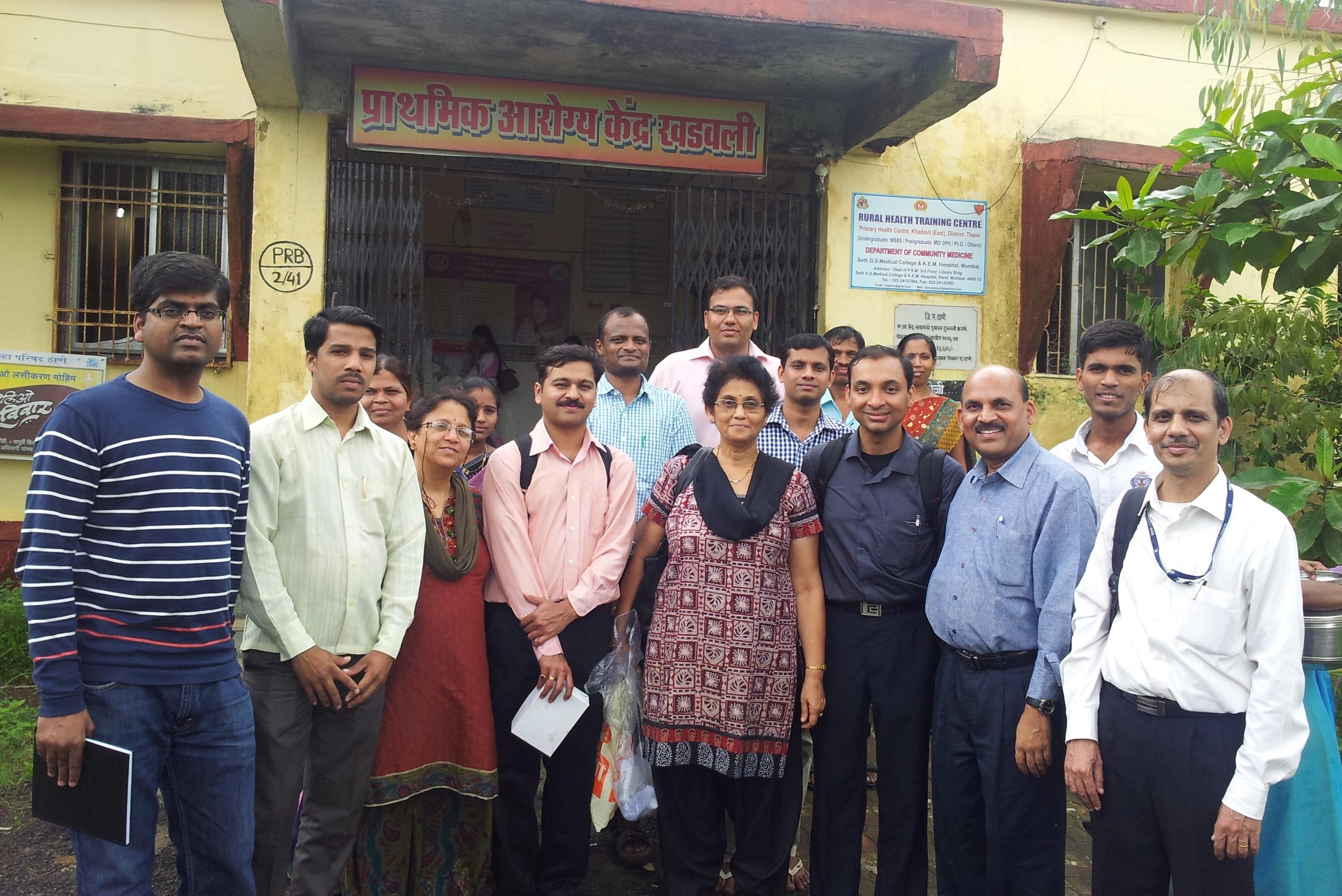 Naga Siva Kumar Gunda, left, and Sushanta Mitra, fourth from right, pose for a group photo during field trials of their water testing technology in rural India.