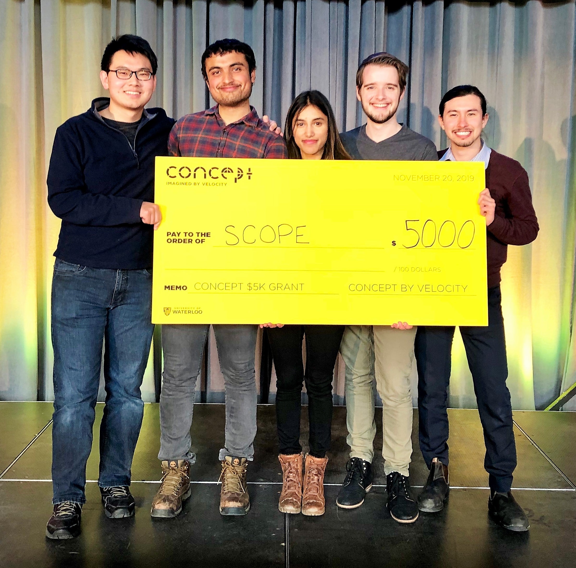 Scope members (left to right) Zhenle Cao, Ishan Mishra, Alisha Bhanji, Holden Beggs and Fernando Pena pose with their ceremonial cheque.