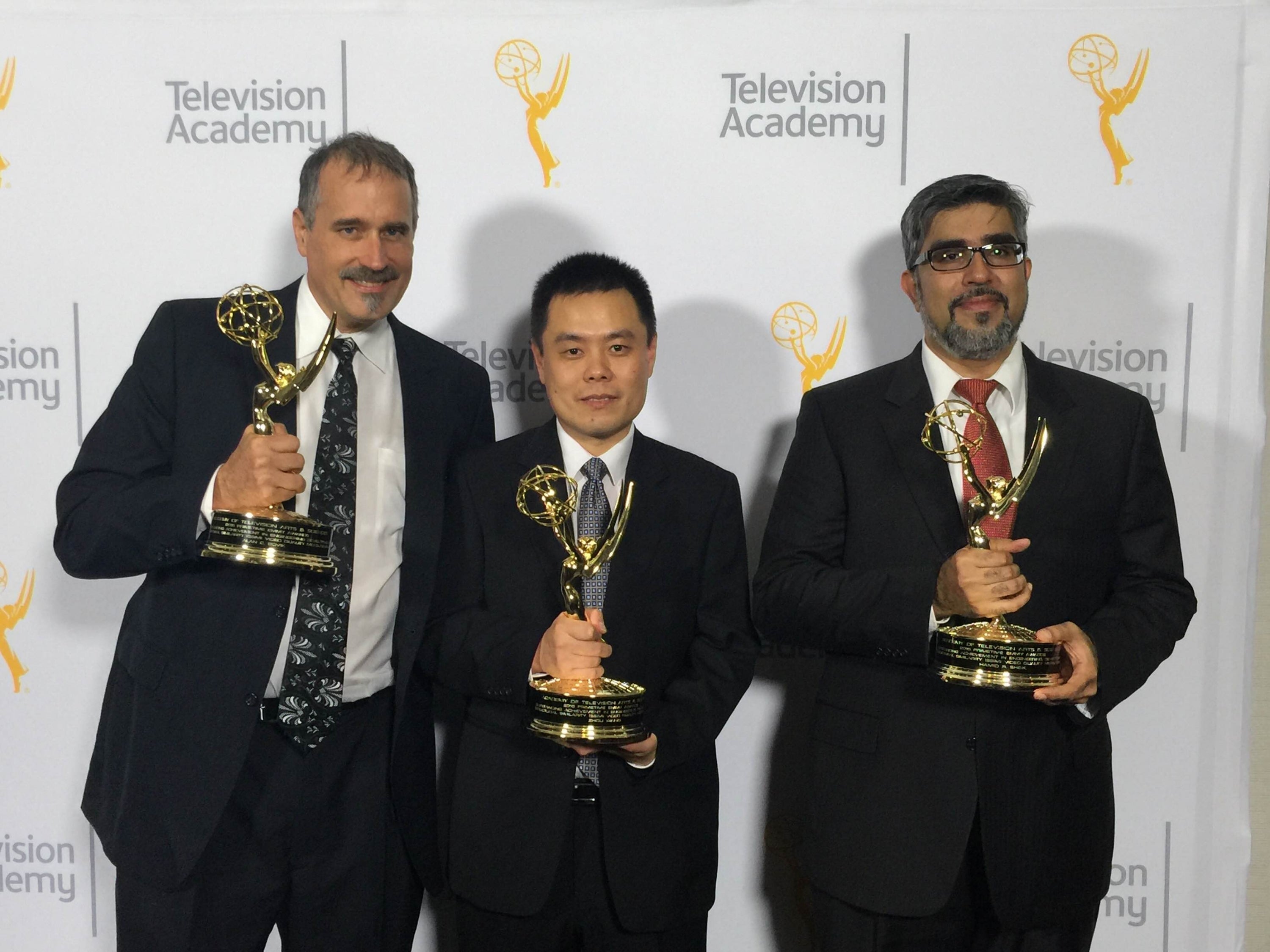 Zhou Wang and his colleagues with their awards.