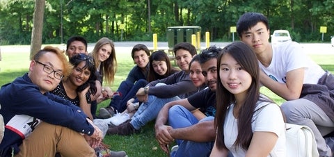 Students sitting together outside
