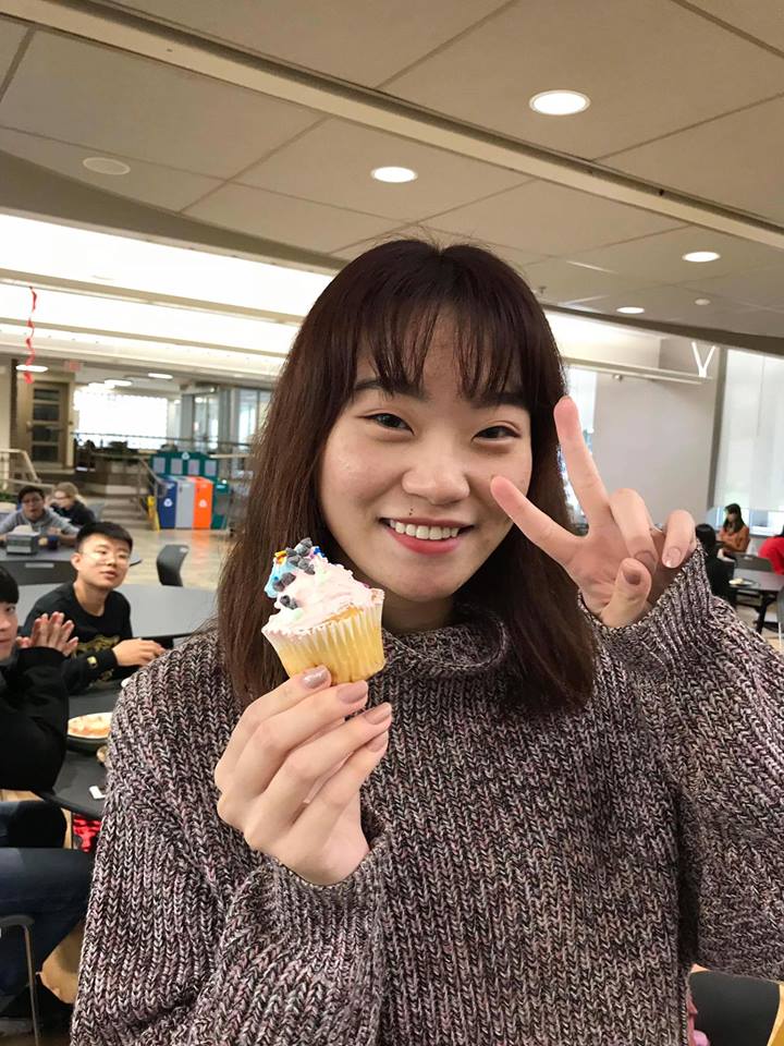 Crystal Liu with a cupcake