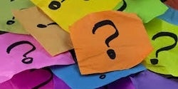 Phone of sticky notes with question marks.