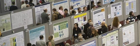 People looking at poster presentations.