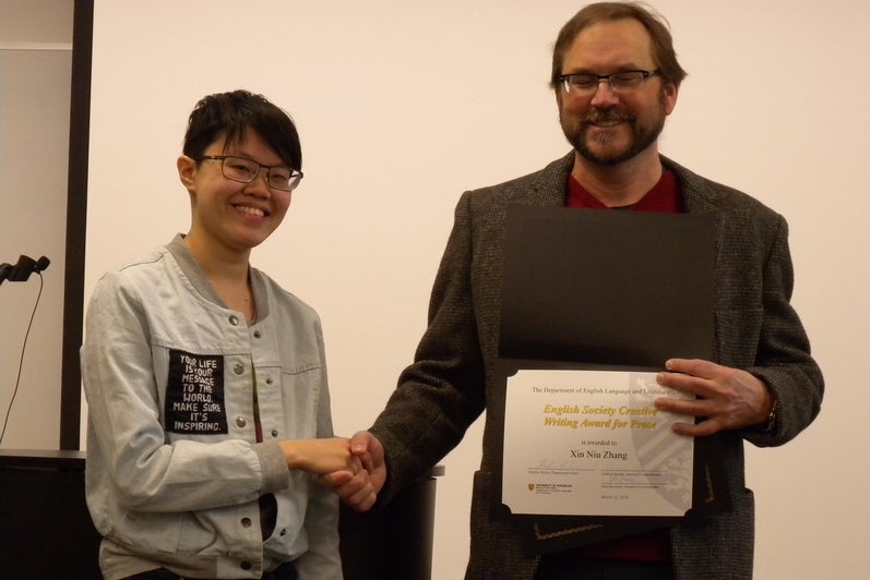 Xin Niu Zhang receives the English Society Creative Writing Award for Prose and the Albert Shaw Poetry Prize from Andrew McMurry