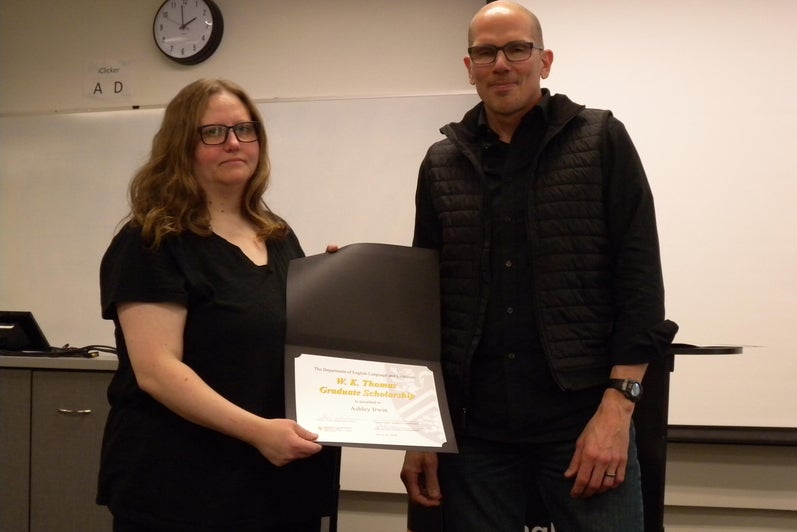 Ashley Irwin receives the W.K. Thomas Graduate Scholarship and David Nimmo English Graduate Scholarships from Marcel O’Gorman.