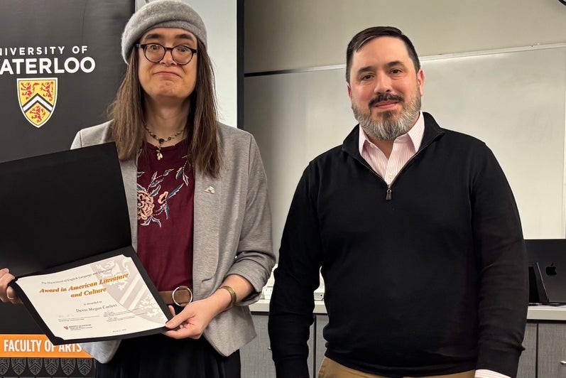 Dr. Carter Neal presents Devin Carless with the Award in American Literature and Culture.