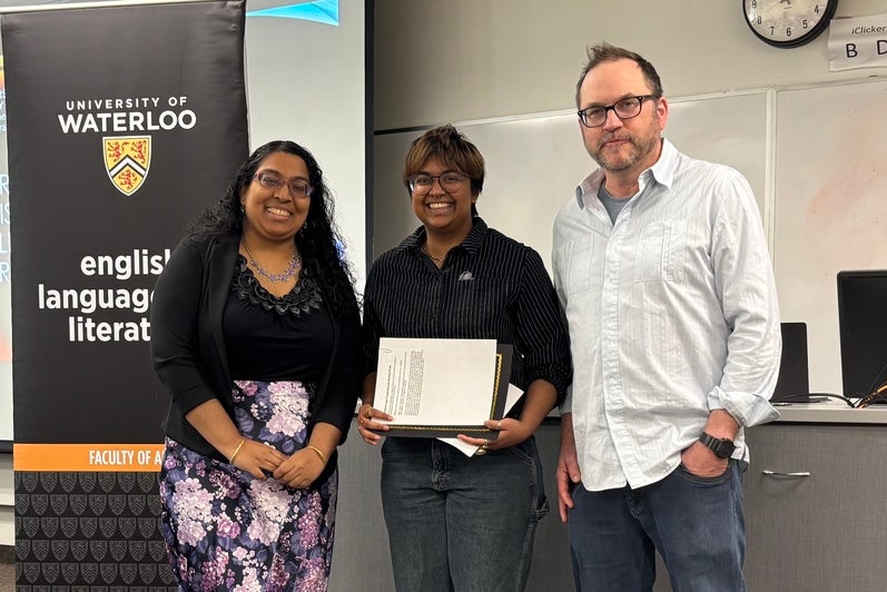Donor Sara Kannan and Dr. Andrew McMurry present Amaya Kodituwakku with the Diaspora and Transnational Studies Prize.