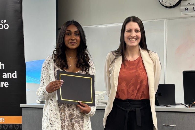 Dr. Megan Selinger presents Bavithra Amuthalakan with the G.R. Hibba​rd Shakespeare Prize.