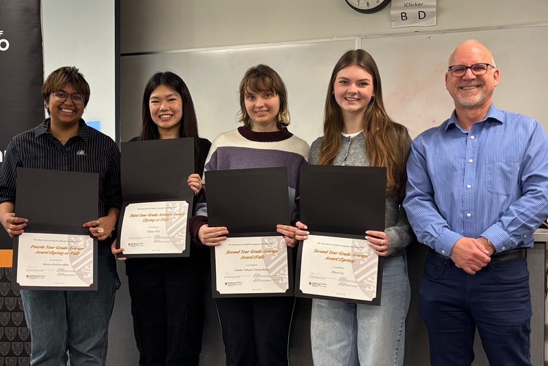 Dr. Bruce Dadey presents grade point awards to Amaya Kodituwakku (fourth year), Tiffany Wen (third year), Annika Nehaniv-Dautenhahn (second year) and Maya Ley (second year).