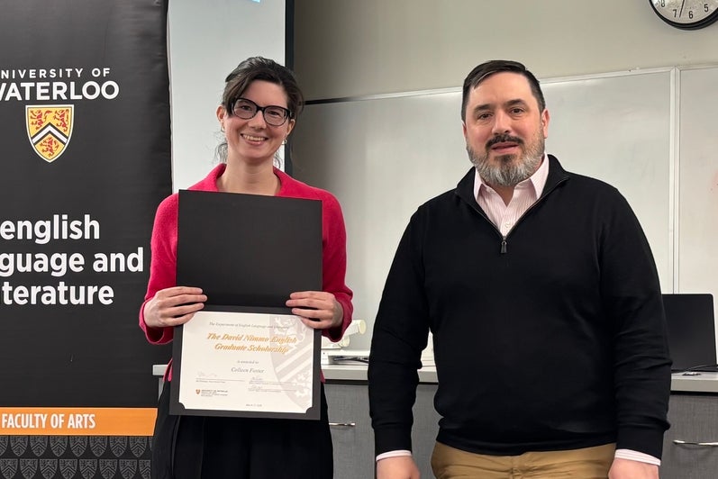 Dr. Carter Neal presents Colleen Foster with the David Nimmo English Graduate Scholarship.