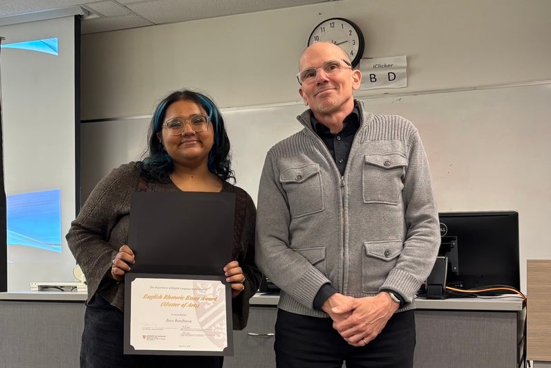 Dr. Marcel O'Gorman presents Zoya Randhawa with the English Rhetoric Essay Award MA.