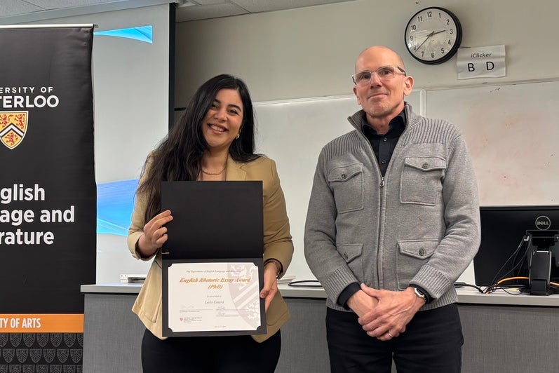 Dr. Marcel O'Gorman presents Laila Emara with the English Rhetoric Essay Award PhD.