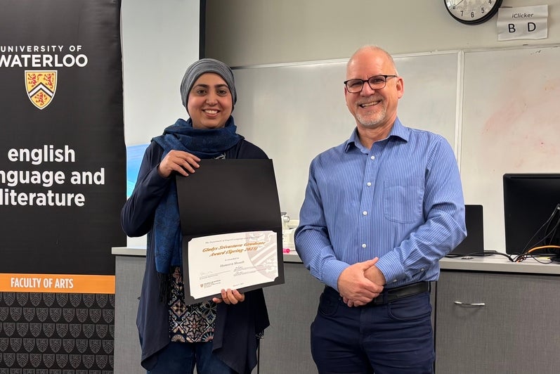 Dr. Bruce Dadey presents Humaira Shoaib with the Gladys Srivastava Graduate Award.