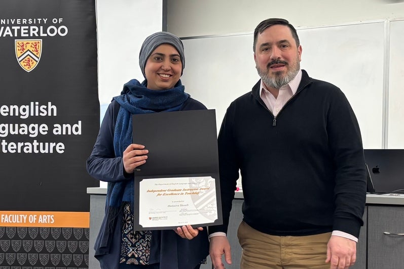 Dr. Carter Neal presents Humaira Shoaib with the Independent Graduate Instructor Award for Excellence in Teaching.