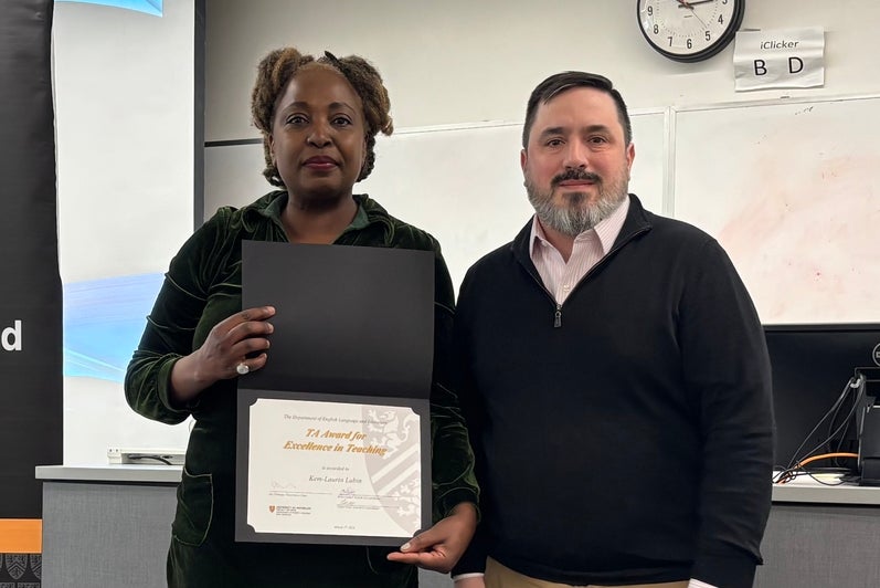 Dr. Carter Neal presents Kem-Laurin Lubin with the TA Award for Excellence in Teaching.