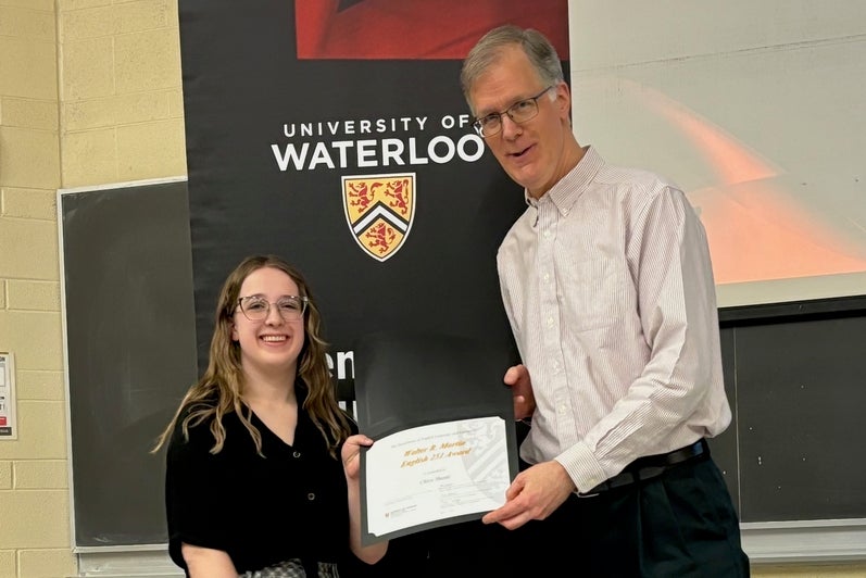 Chloe Shantz receives the Walter R. Martin English 251 Award from Dr. Ken Graham.