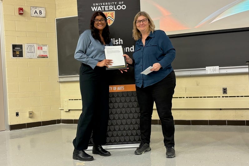 Vyshnavi Rajeevan receives the Co-op Reflective Report Award from Victoria Lamont.