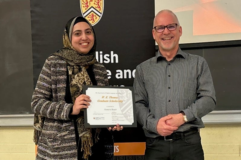 Humaira Shoaib receives the W. K. Thomas Graduate Scholarship from Dr. Bruce Dadey.