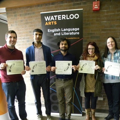 Photo: five graduate award winners show their certificates