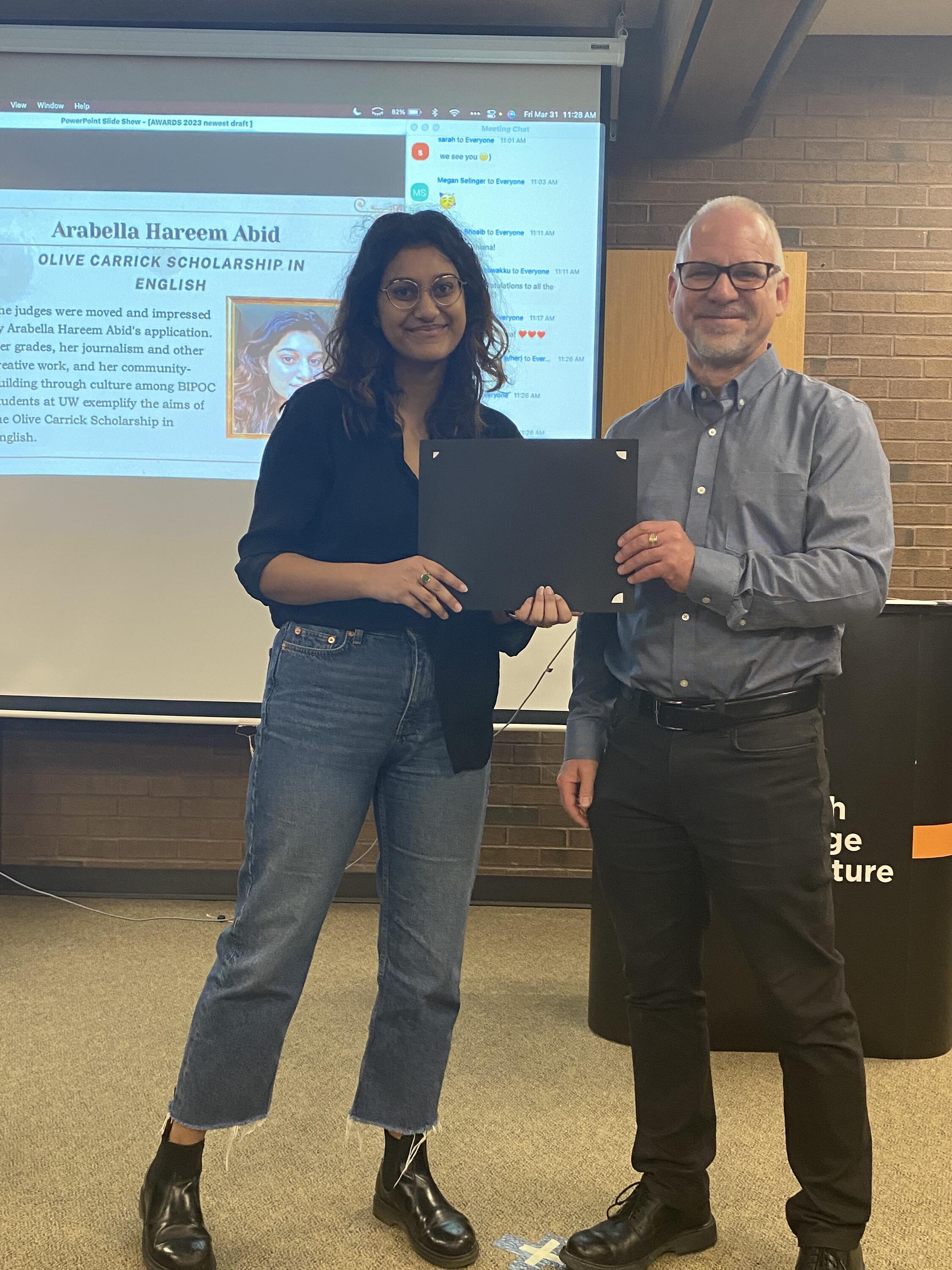 Arabella Hareem Abid receives the Olive Carrick Scholarship in English from Dr. Bruce Dadey.